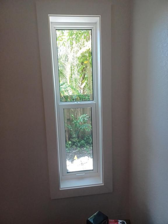 Narrow window in a beige room