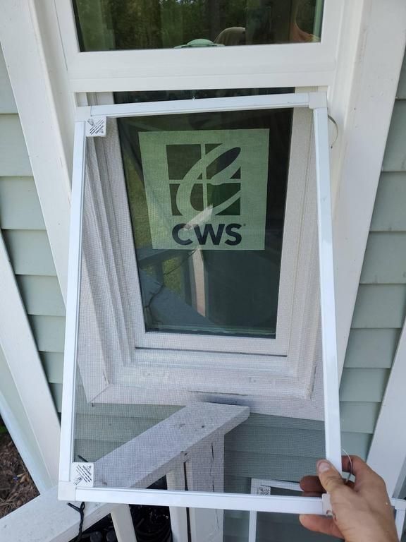 White window frame with a screen