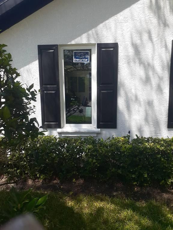 White house exterior with black shutters