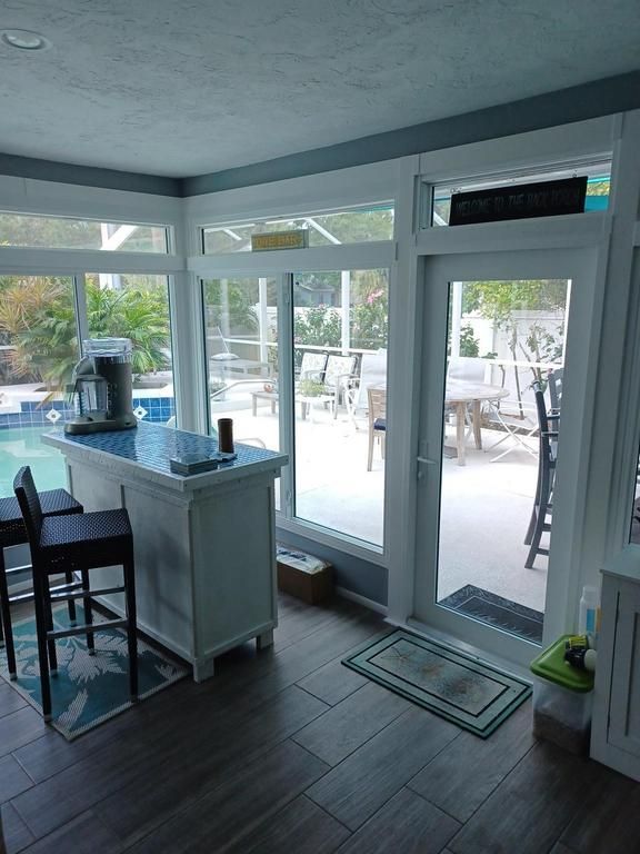 Bright sunroom with a bar counter