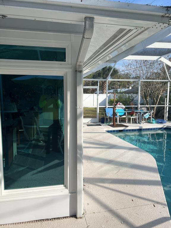 Patio with pool and sliding windows