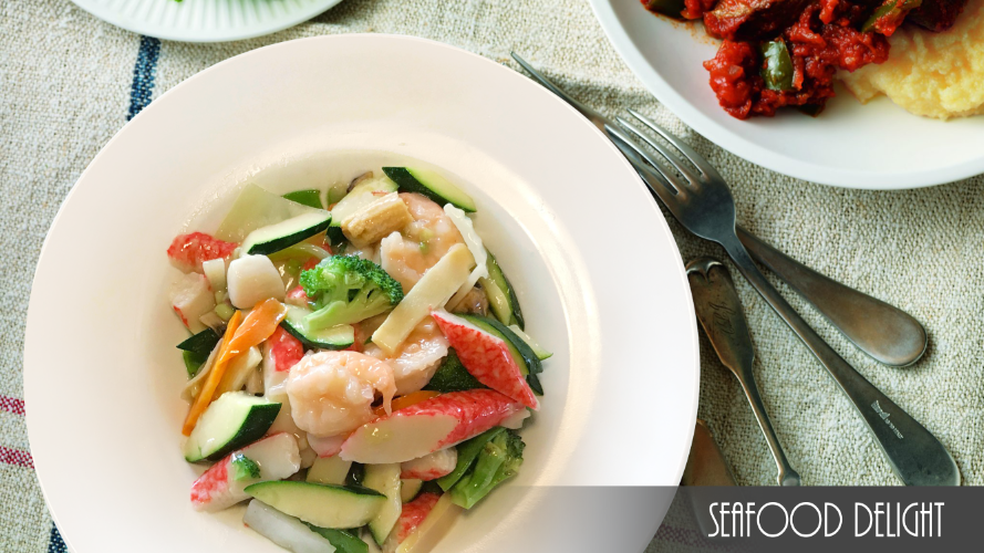 A plate of seafood delight sits on a table