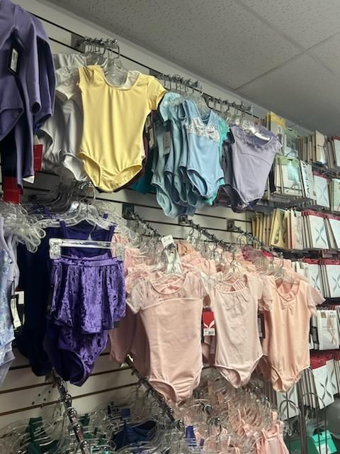 A wall with a bunch of clothes hanging on it