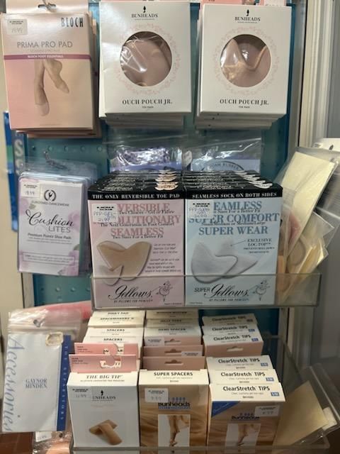 A shelf filled with a variety of foot care products