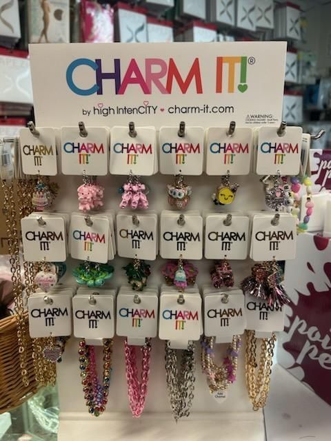 A display of charm it jewelry in a store