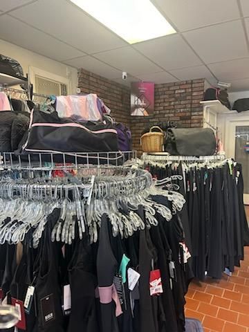 A store filled with lots of clothes and bags.