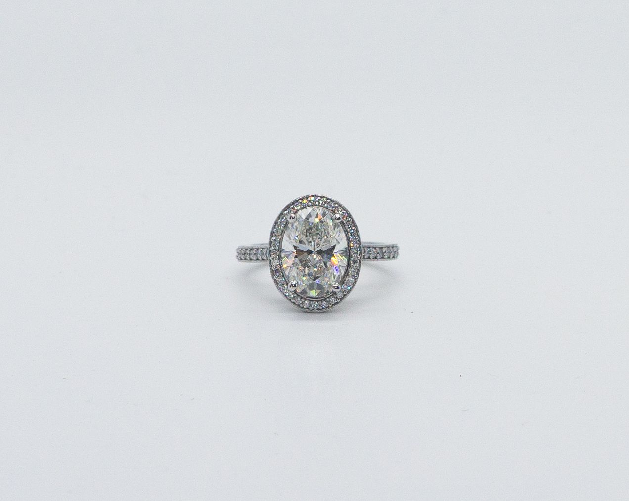 Oval diamond ring on a white background