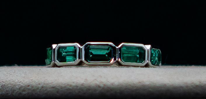 Emerald-cut turquoise ring in silver on a dark surface