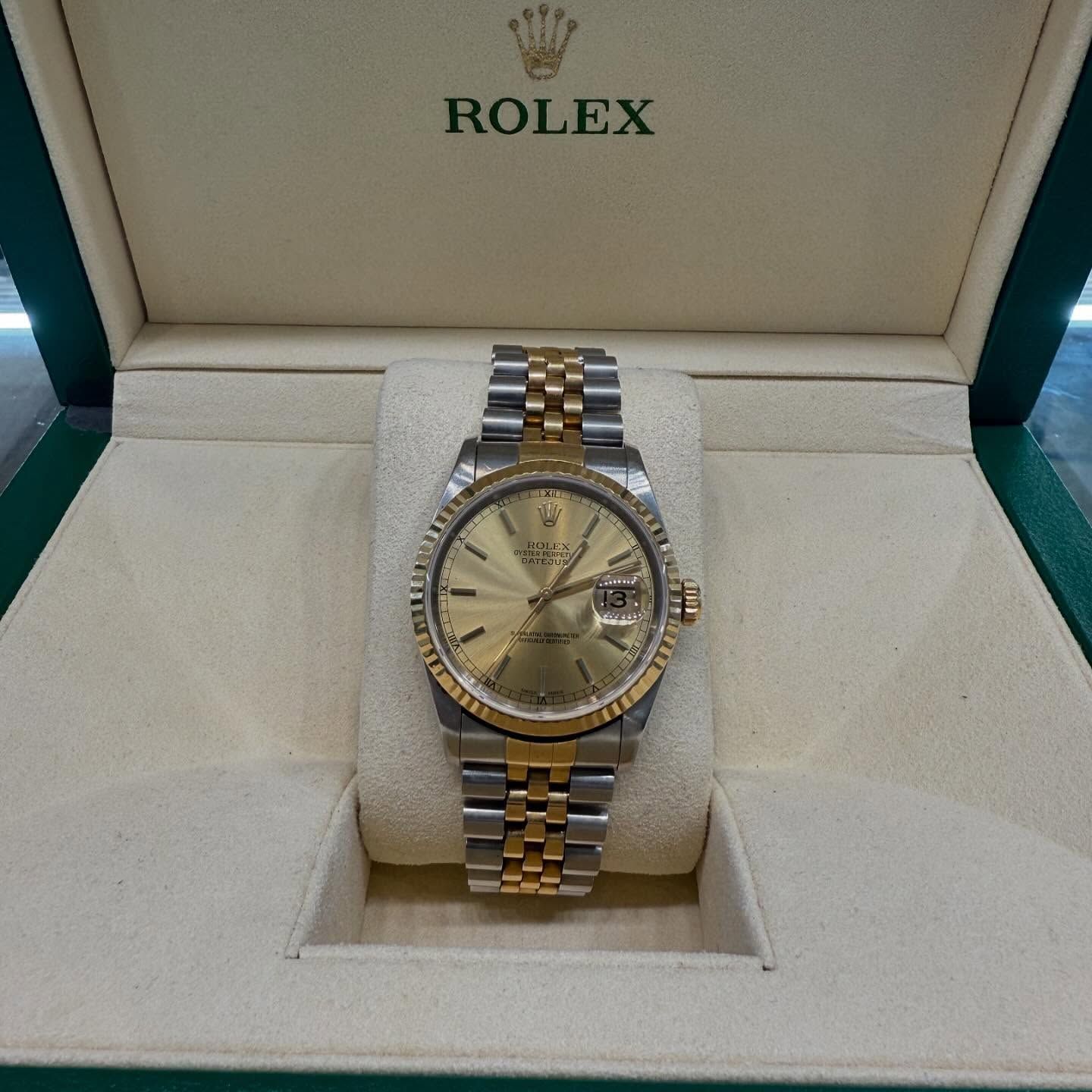 Rolex two-tone gold and silver watch in an open display box