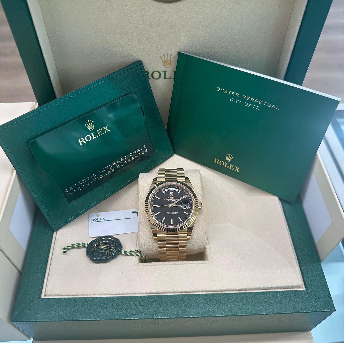 Green Rolex gift set with gold watch and matching bracelet in a presentation box