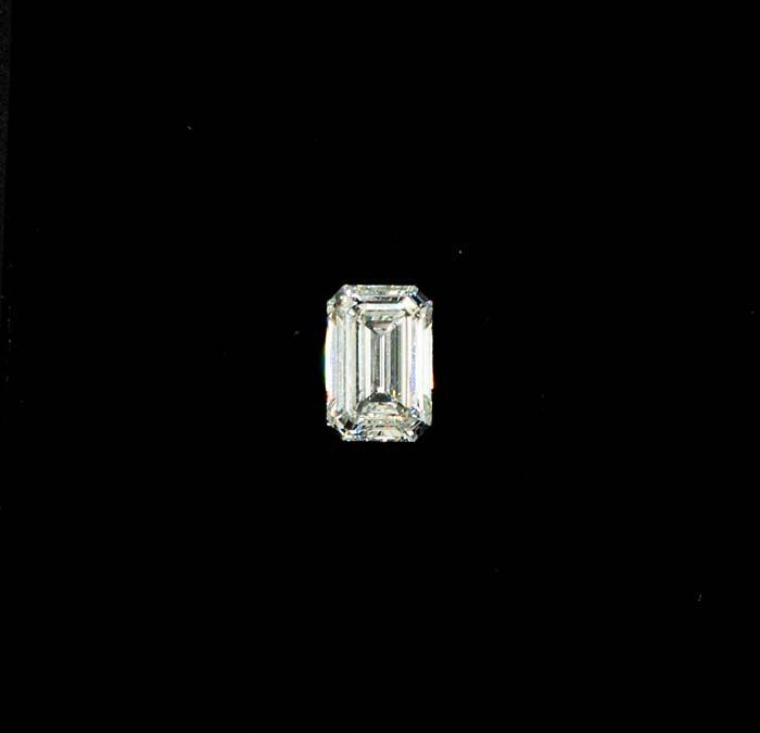 Small rectangular clear gemstone on a black background