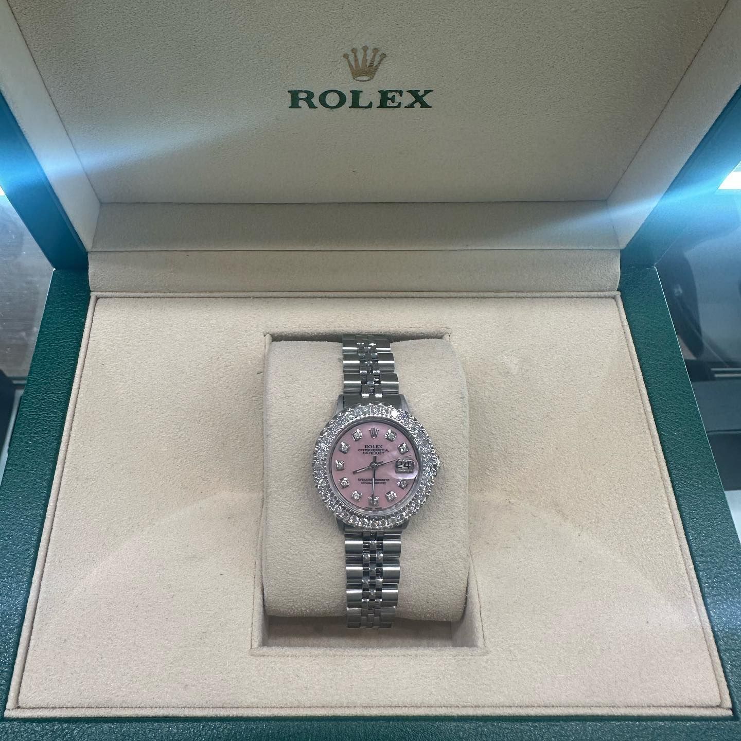 Rolex watch with pink dial in a presentation box