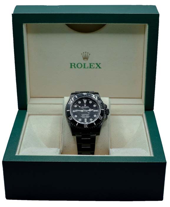 Rolex watch in an open green display box