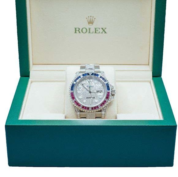 Rolex watch in green presentation box with white interior