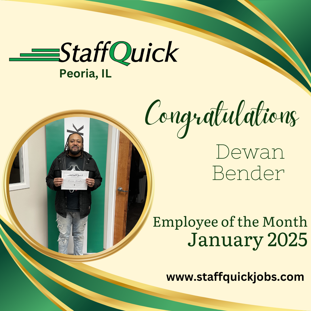 A man is standing in front of a door holding a certificate.