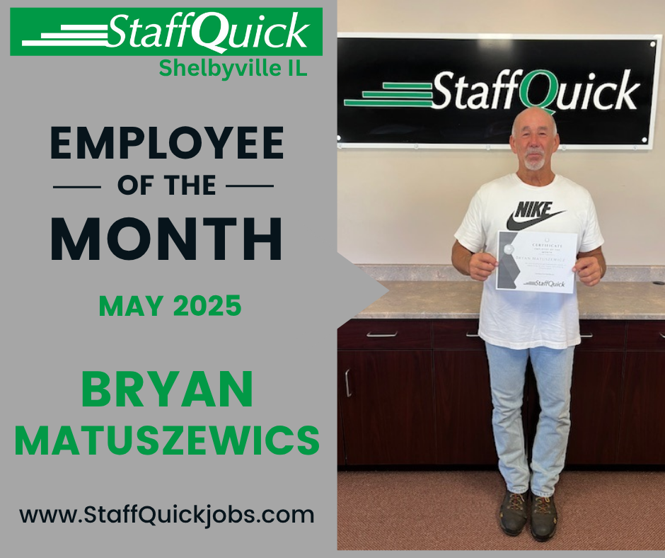 A man is standing in front of a sign that says staff quick