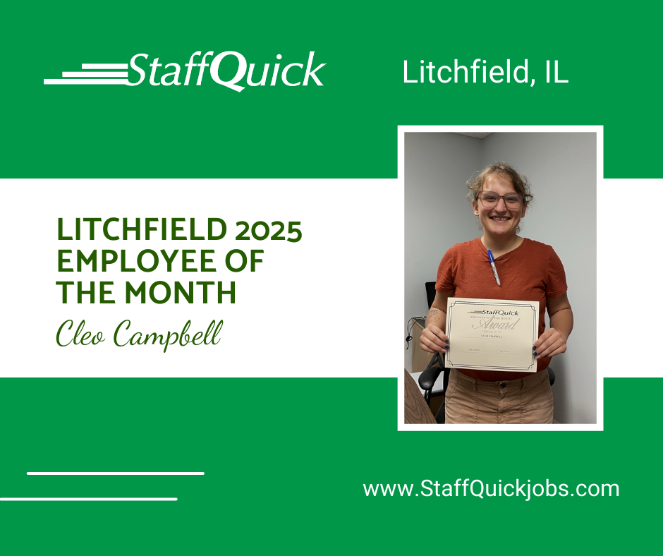 A woman is holding a certificate in front of a green background.