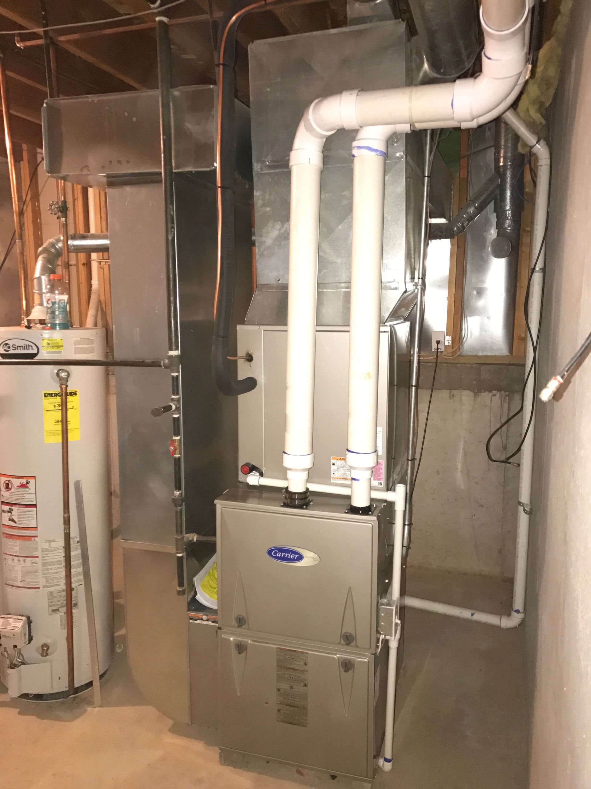 There is a water heater and a furnace in the basement.