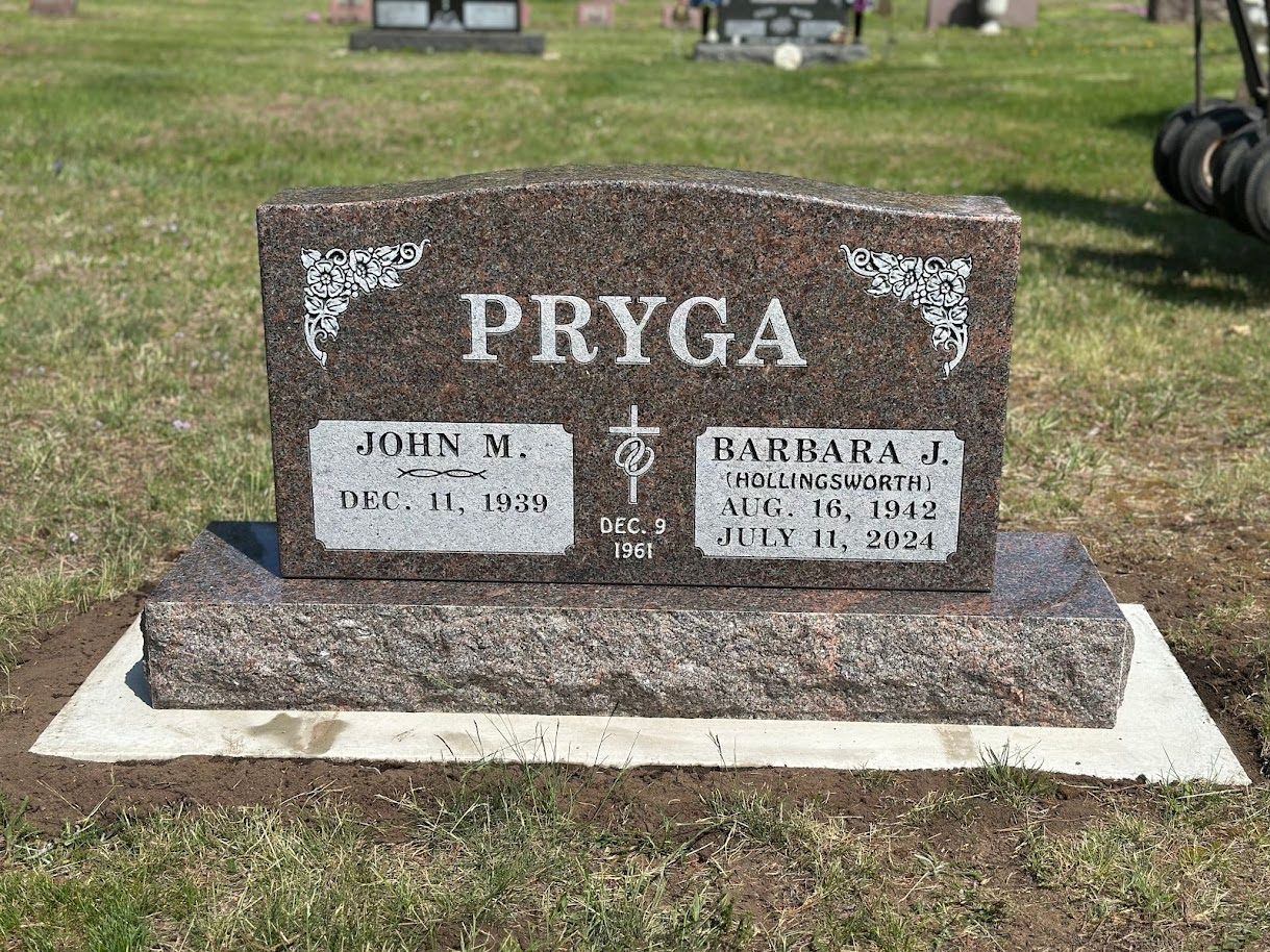 A granite headstone inscribed 
