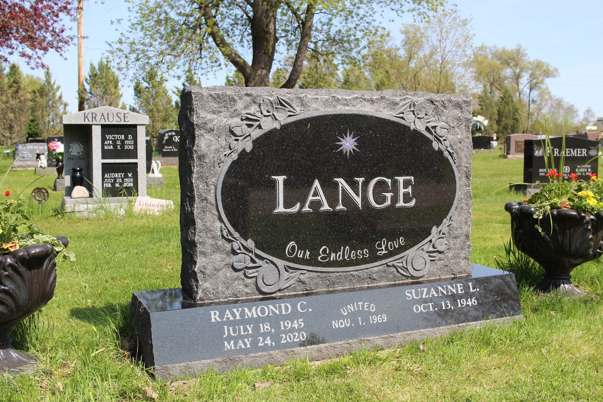 A black granite headstone with 