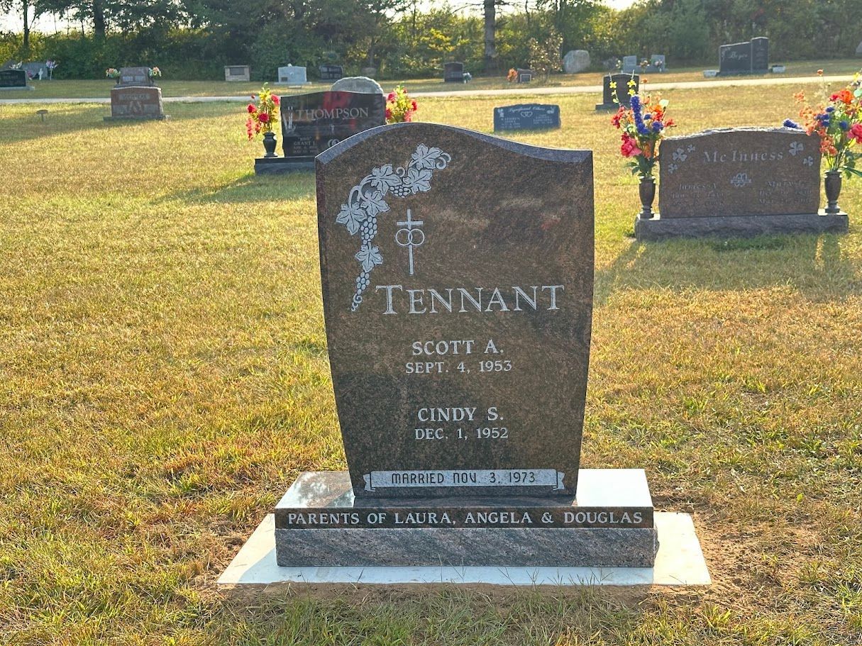 A gravestone in a cemetery