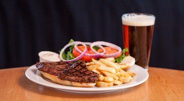 Stucko's steak burger with fries beer