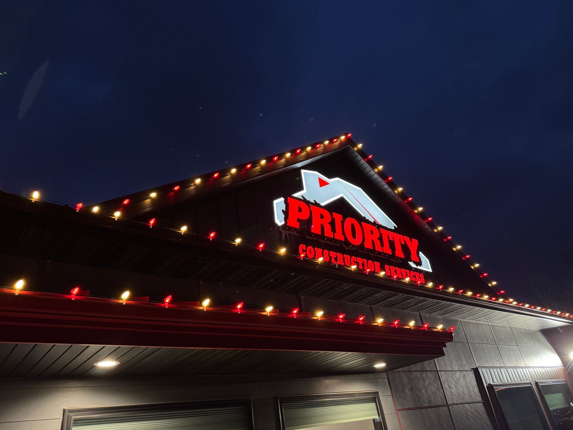 A building with a sign that says “Priority” on it