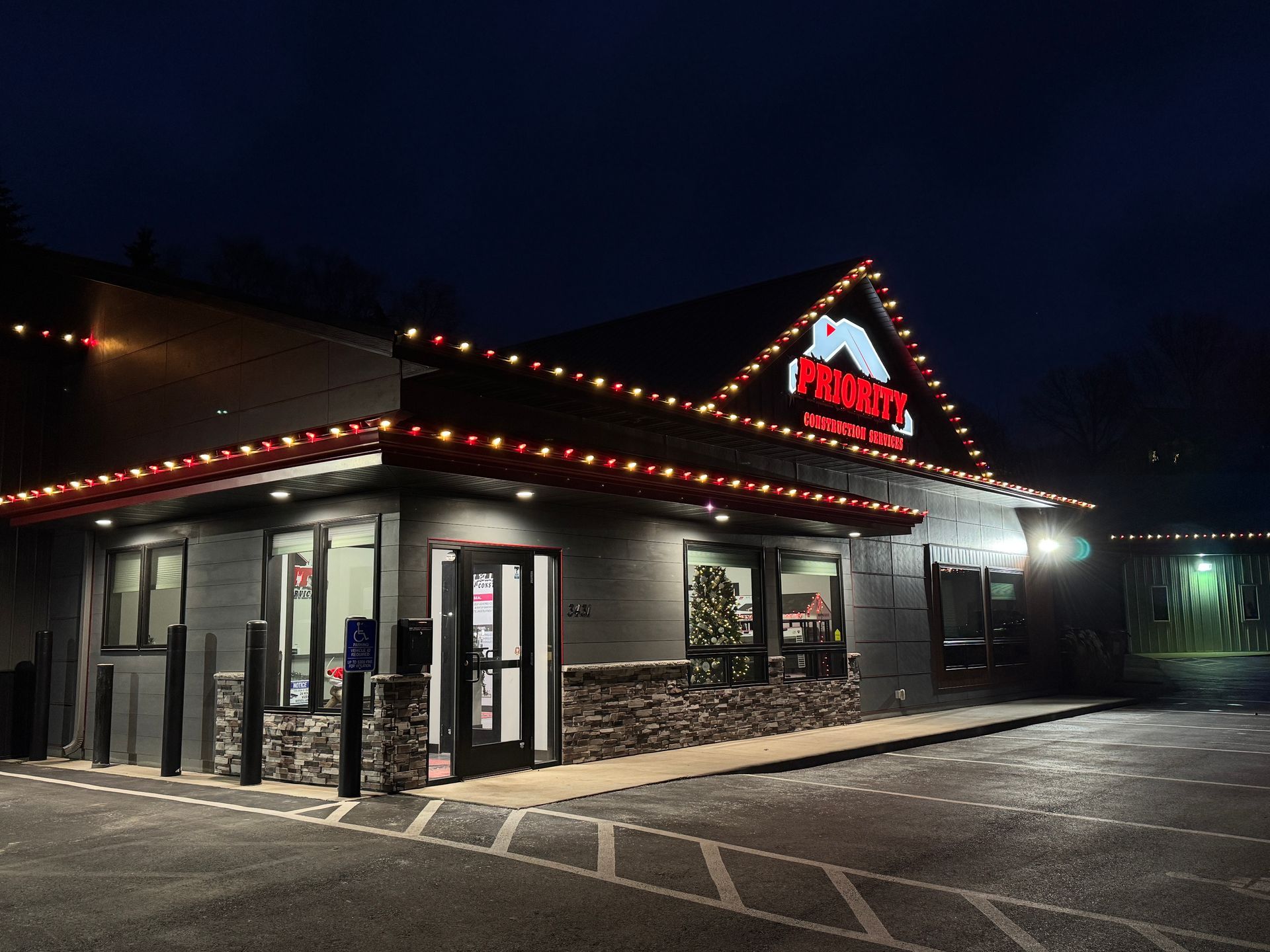 A restaurant with Christmas lights on.