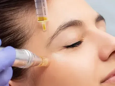 Cosmetic treatment on woman’s cheek with syringe and handheld device applied near the eye