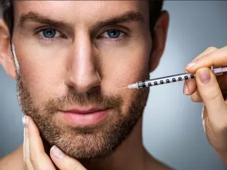 Close-up of a man measuring his mustache with a small ruler, focused expression