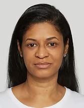 Head-and-shoulders portrait of a woman with long dark hair against a light background