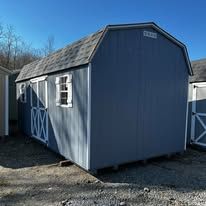An empty room with wooden walls and a door.