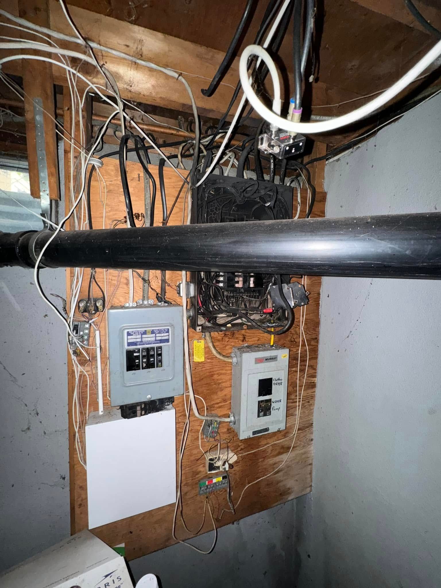 A room with a lot of wires hanging from the ceiling.