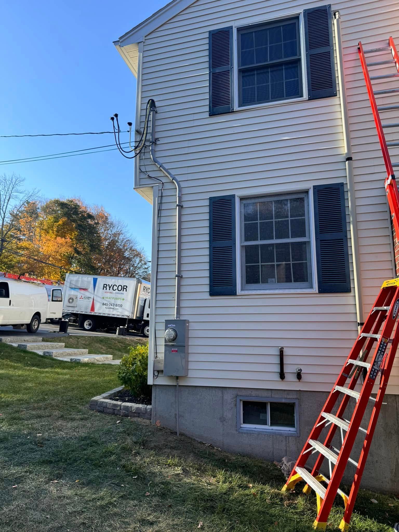 A ladder is leaning against the side of a house.