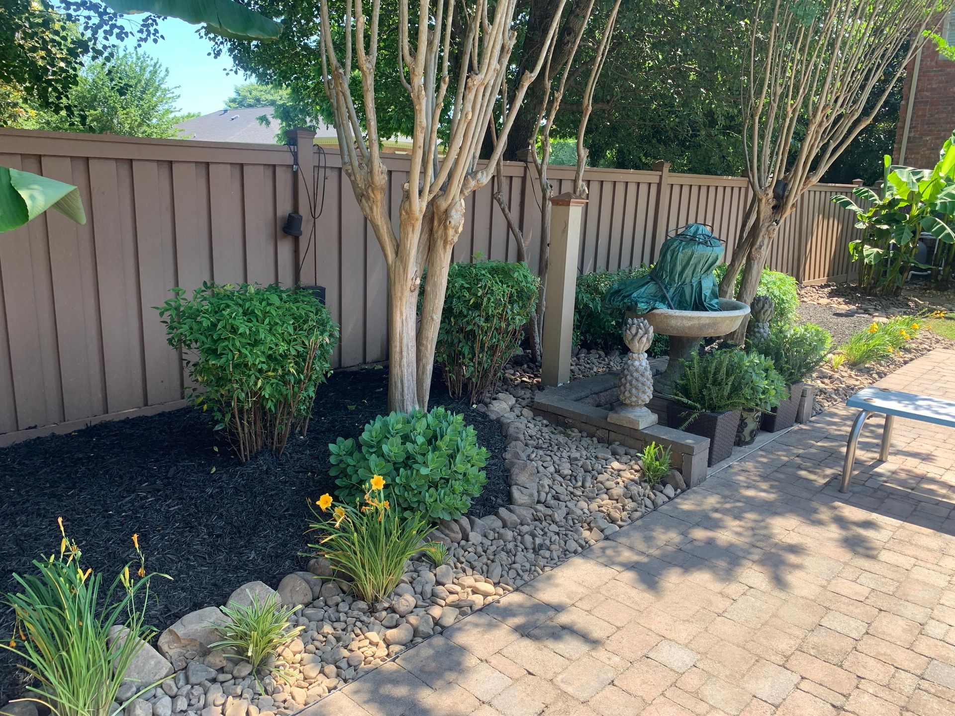 There is a fountain in the middle of the garden.