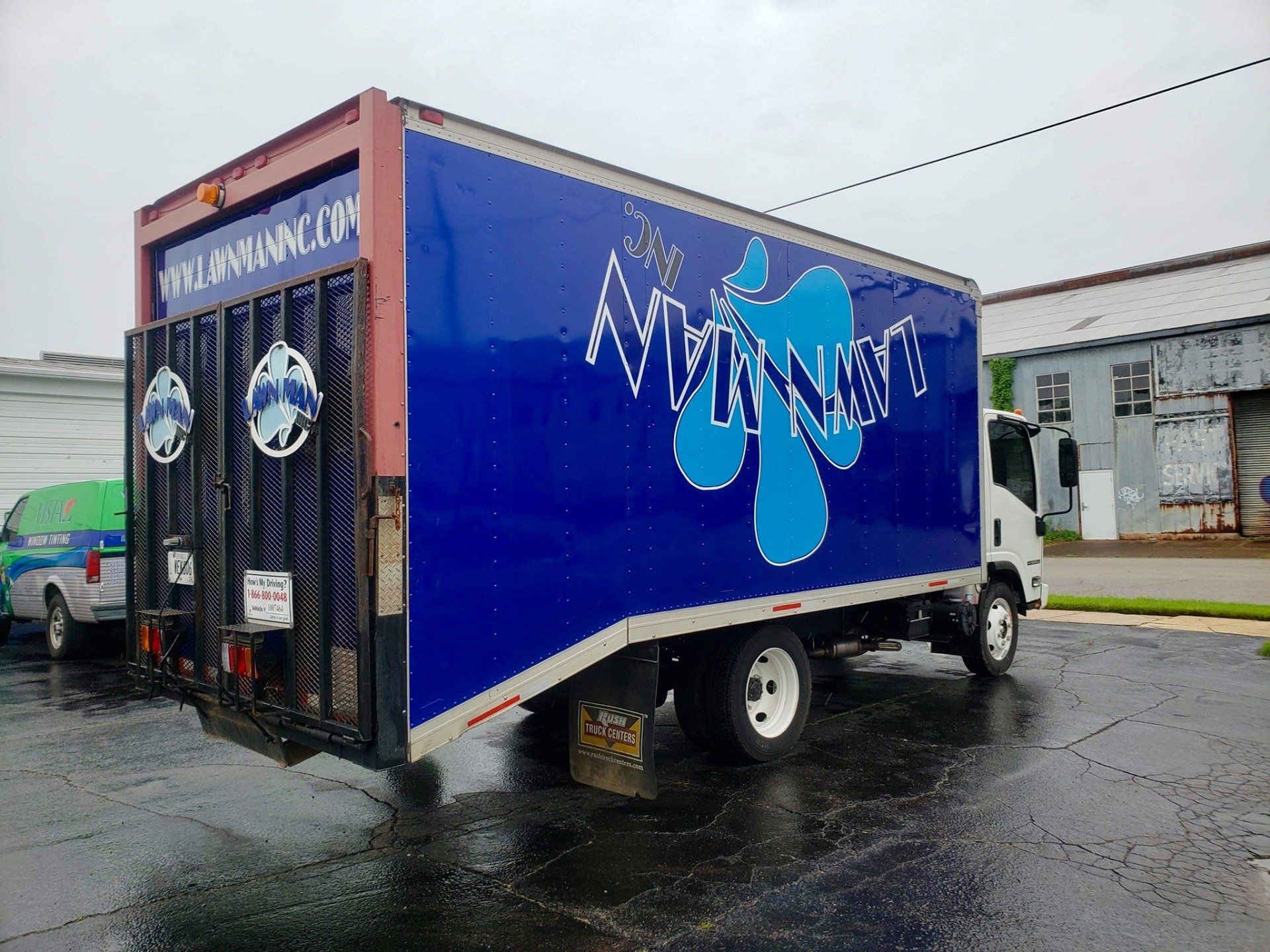 A blue truck with the word aqua on the side