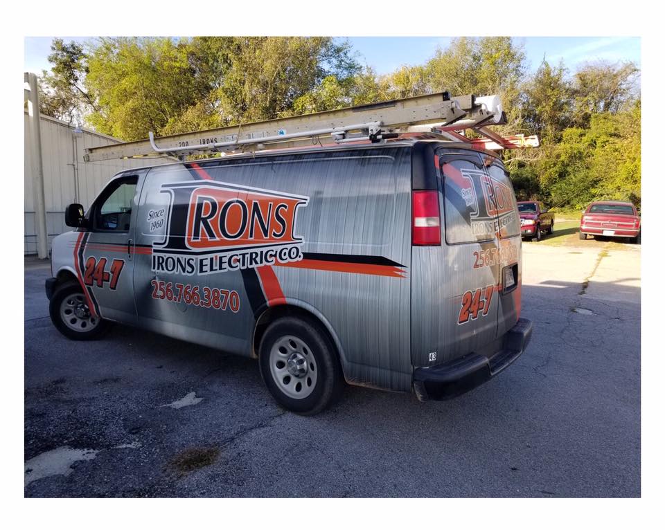 A roast electric van is parked in a parking lot