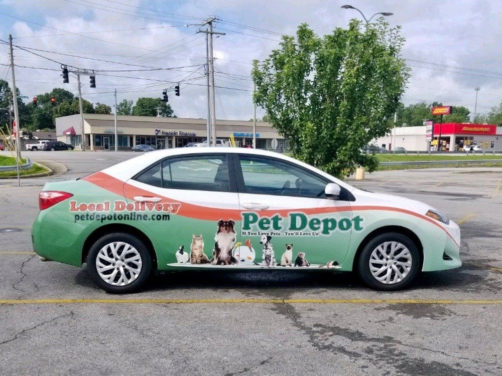 A pet depot car is parked in a parking lot