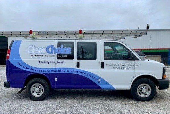 A white and blue van with the word clear choice on it