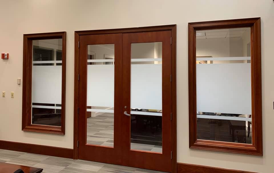 A room with a lot of windows and doors