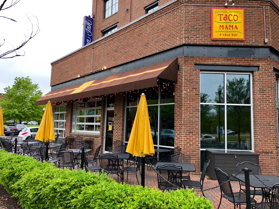 A brick building with a sign that says toco mama