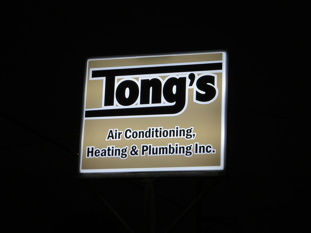 Tong's Air Conditioning, Heating & Plumbing, Inc. signage view at night