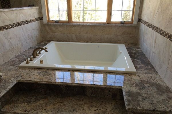 bathtub with stone surround