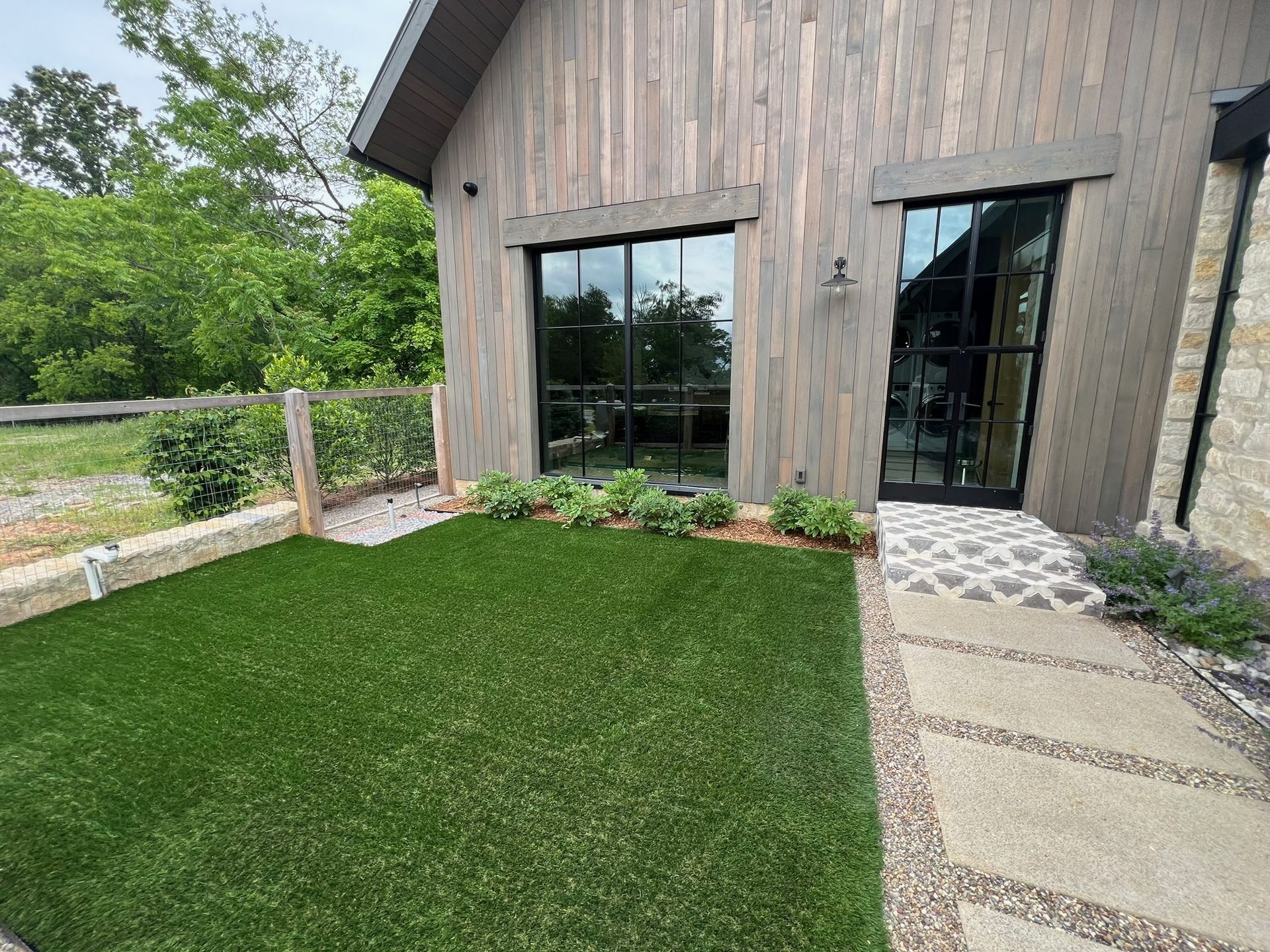 A large house with a large lawn in front of it.
