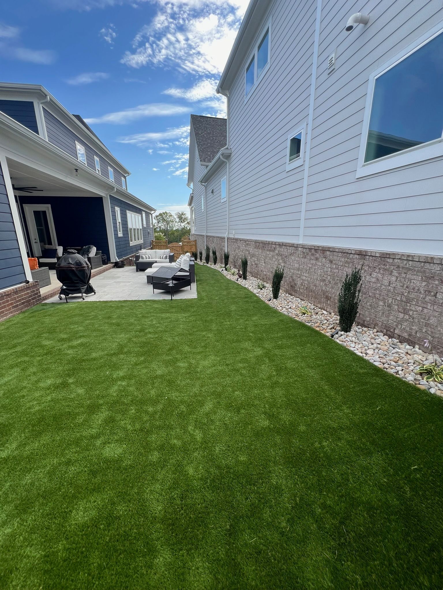 A large house with a large lawn in front of it.