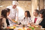 A man giving service in restaurant to customrs