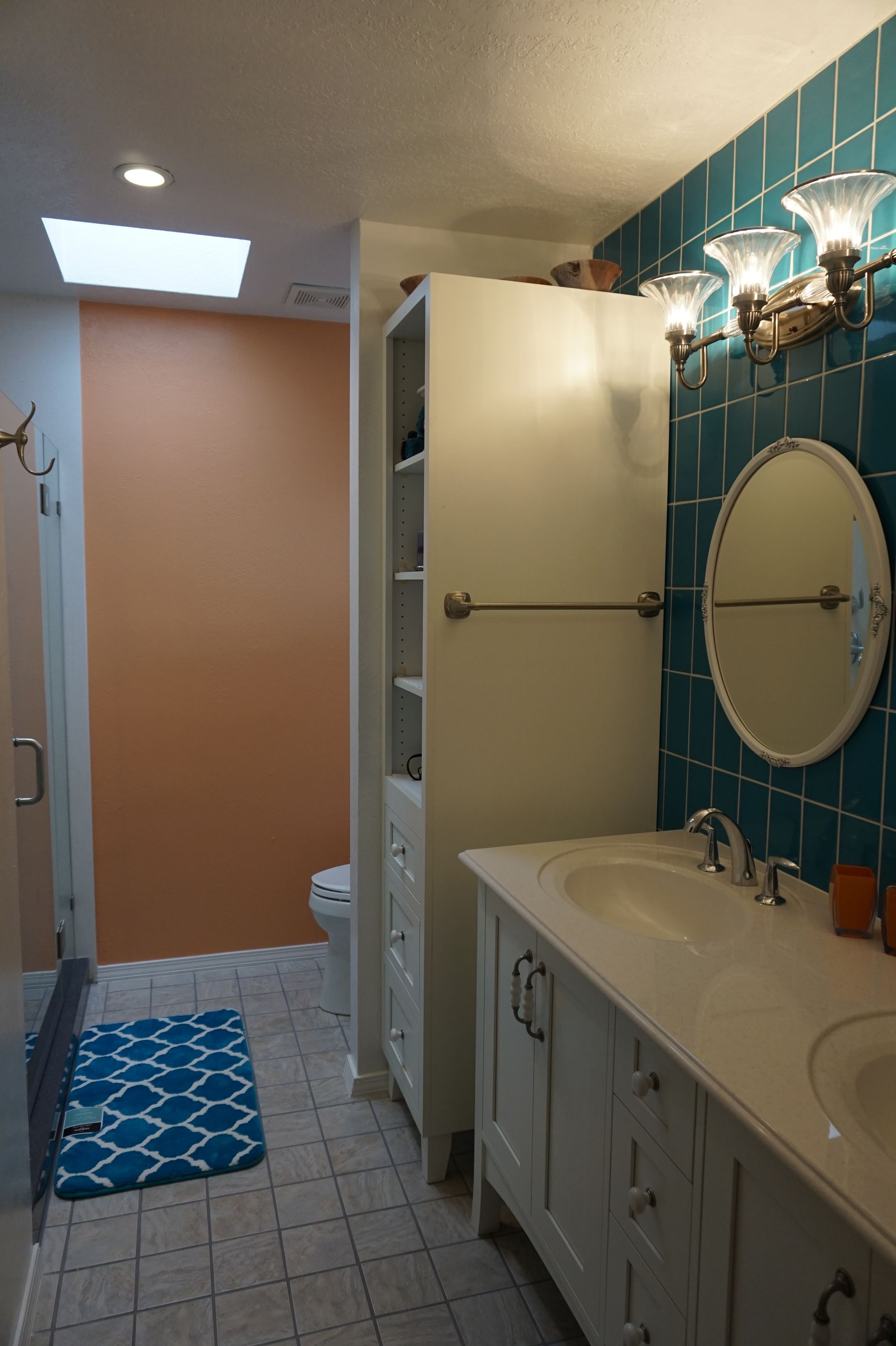a bathroom with a sink, mirror and toilet