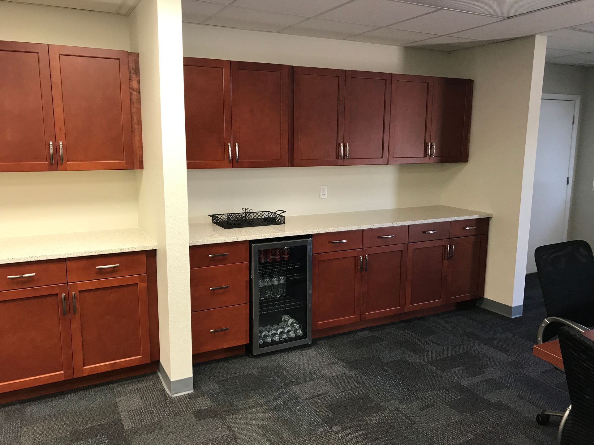 wooden cabinets and a refrigerator
