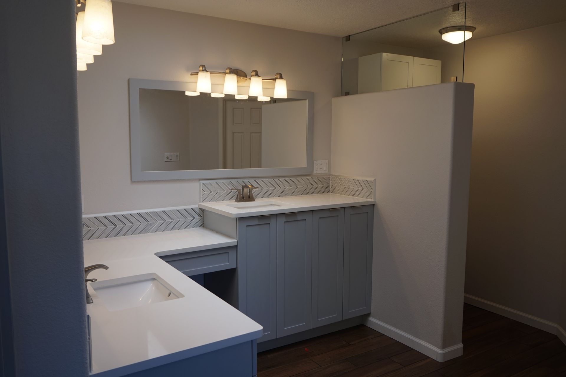 a bathroom with two sinks and a mirror