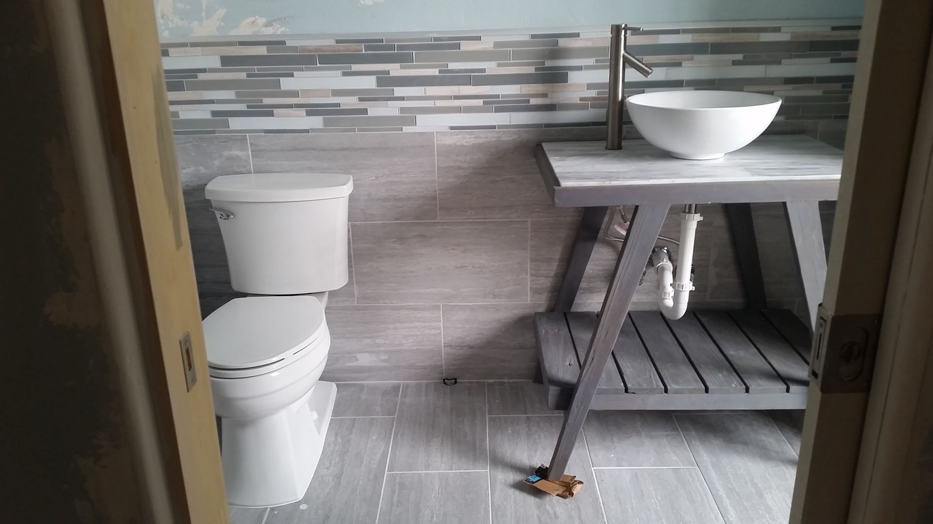 a bathroom with a toilet and sink in it